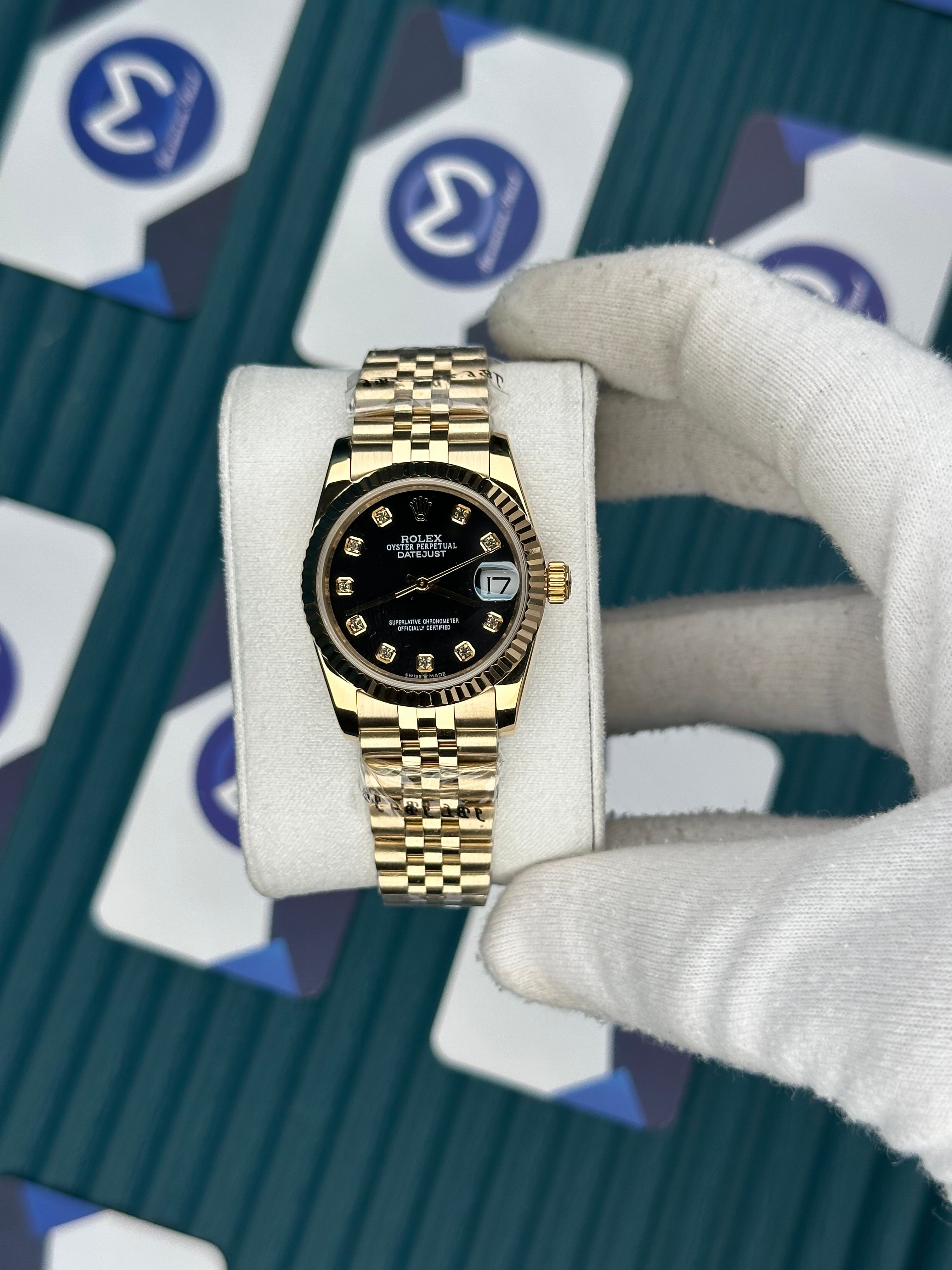 ROLEX 31 BLACK DIAL DIAMOND INDEX GOLD JUBILEE