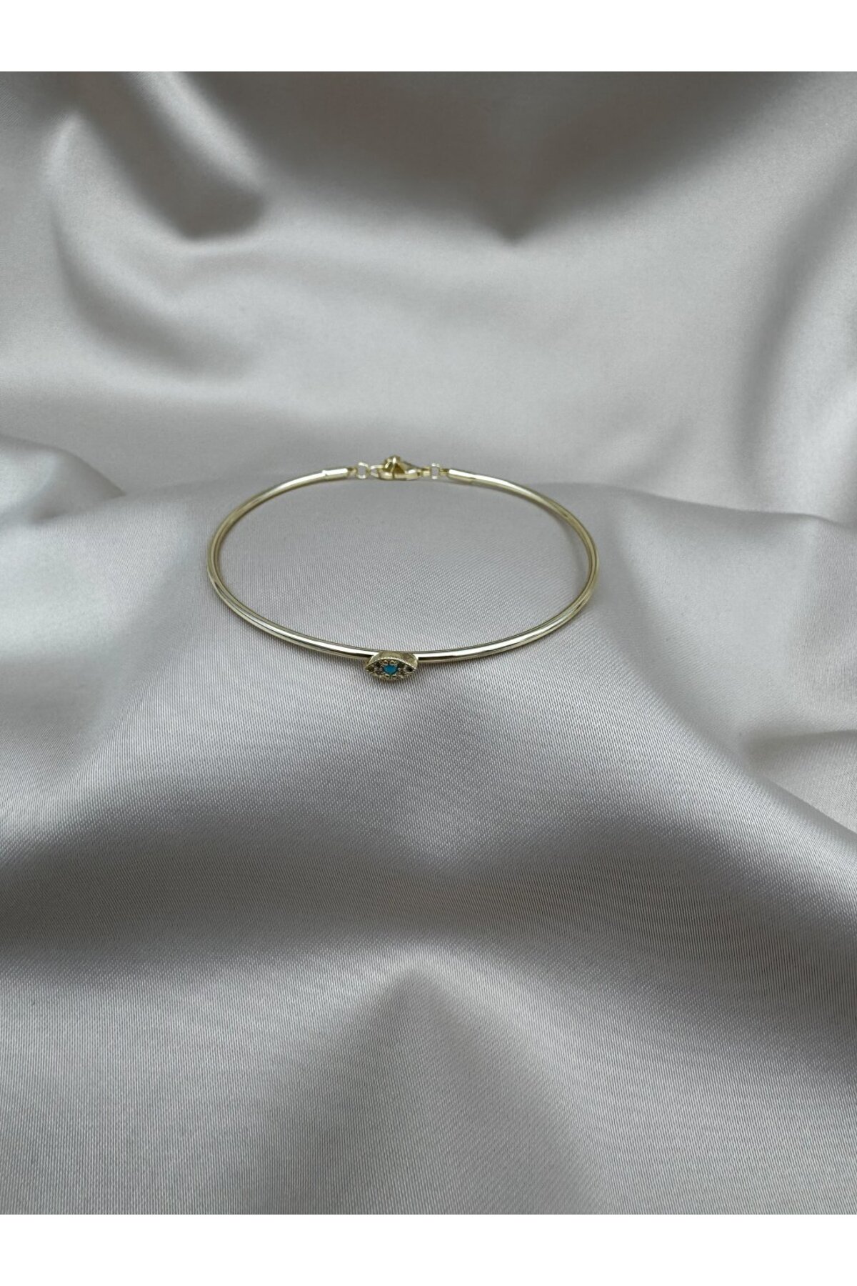 Verstellbares Goldarmband mit blauem Stein und Nazar-Auge