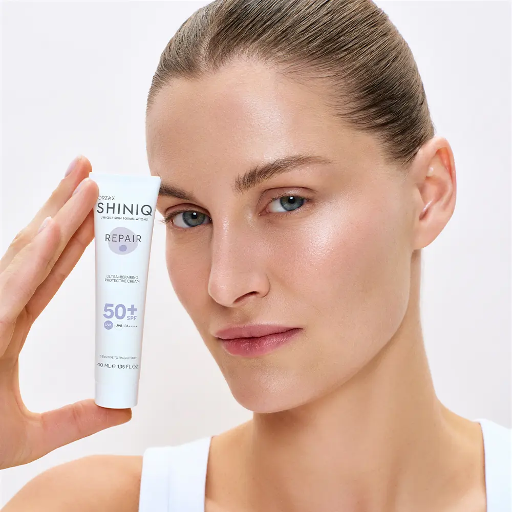 Orzax SHINIQ Onarıcı ve Koruyucu Bakım Kremi SPF 50+ | e-Eczaci