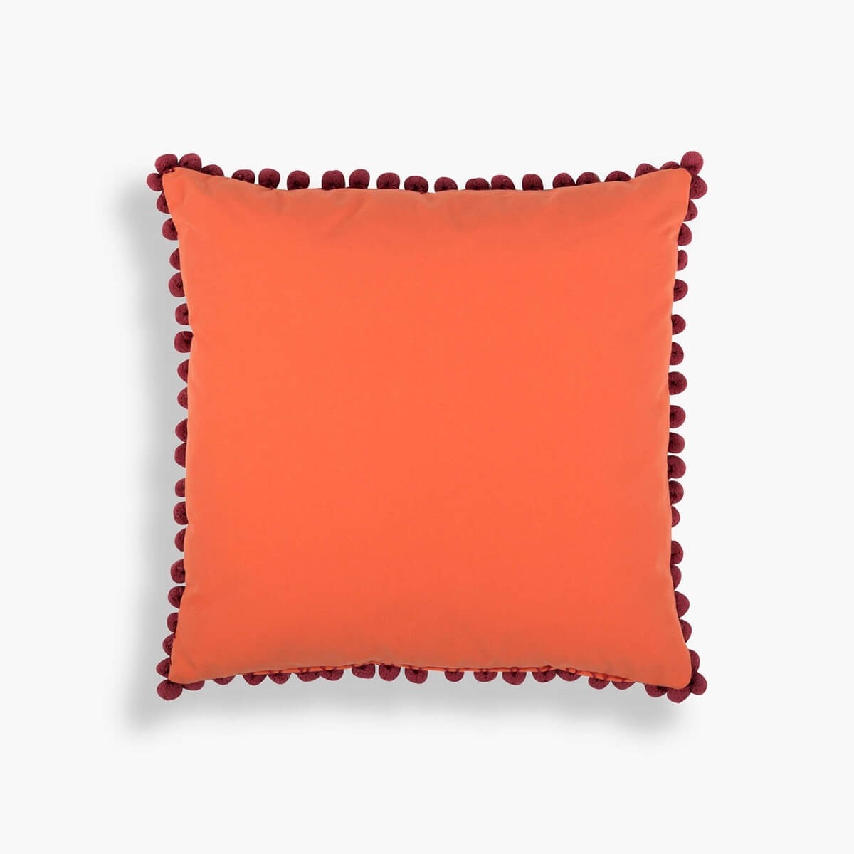 Oranssi tupsut tyynynpäällinen - eläkäämme värikästä elämää!