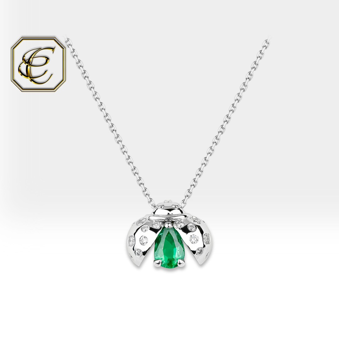 Pear-Shaped Emerald and 1/20 CT. T.W. Diamond Twist Pendant in 10K Gold |  Zales