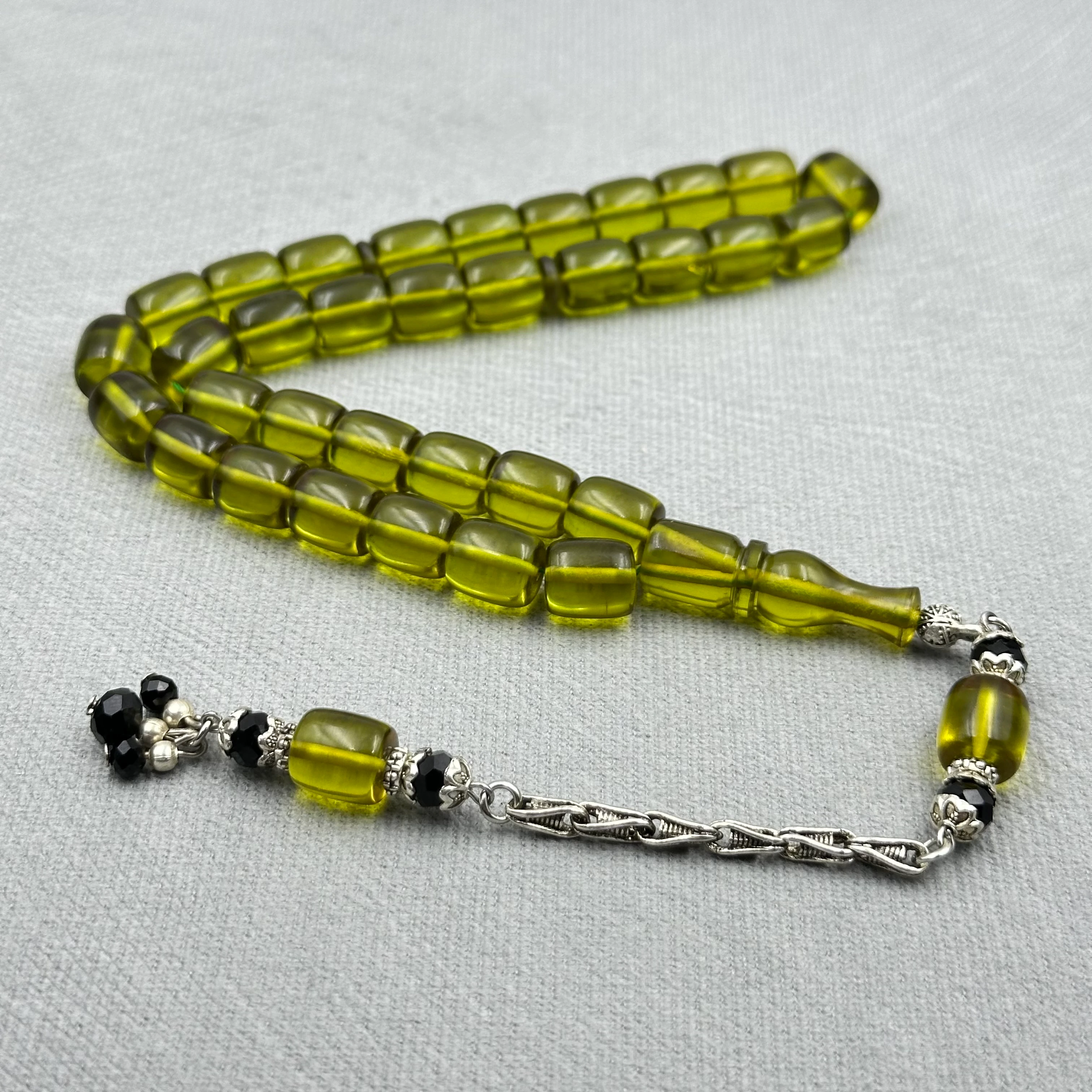 Zeytin Tonlarında Kral Püsküllü Çubuk Kesim Ateş Kehribar Tespih