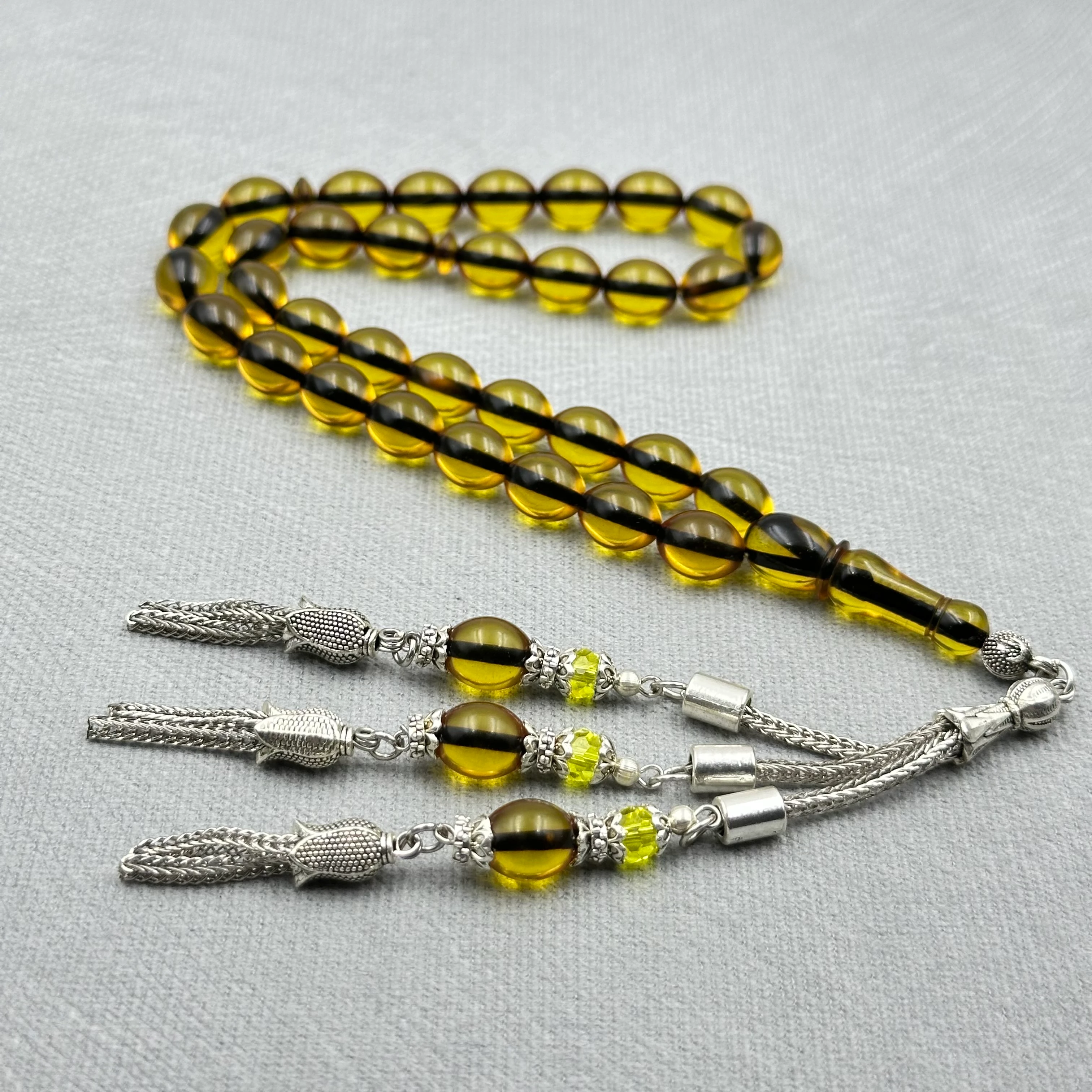 Kehribar Tonlu Şeffaf Yumurta Kesim Üçlü Alpaka Püsküllü Ateş Kehribar Tespih