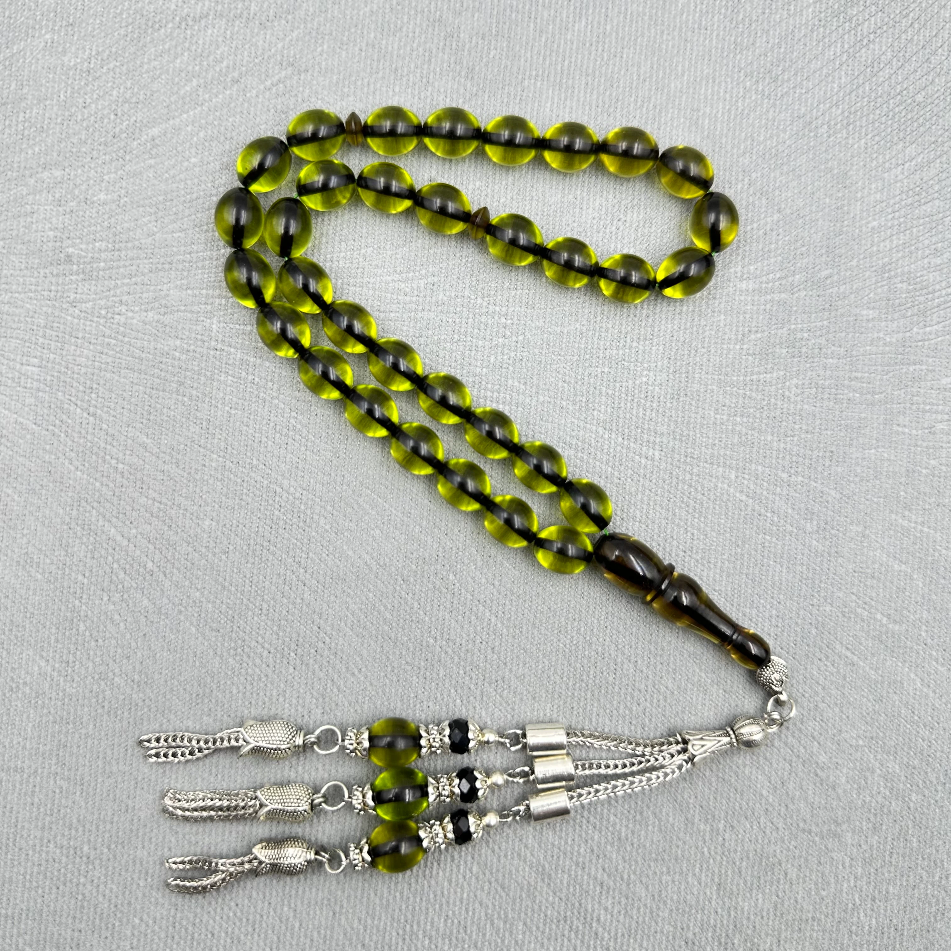 Zeytin Yeşili Yumurta Kesim Üçlü Alpaka Püsküllü Kehribar Tespih 