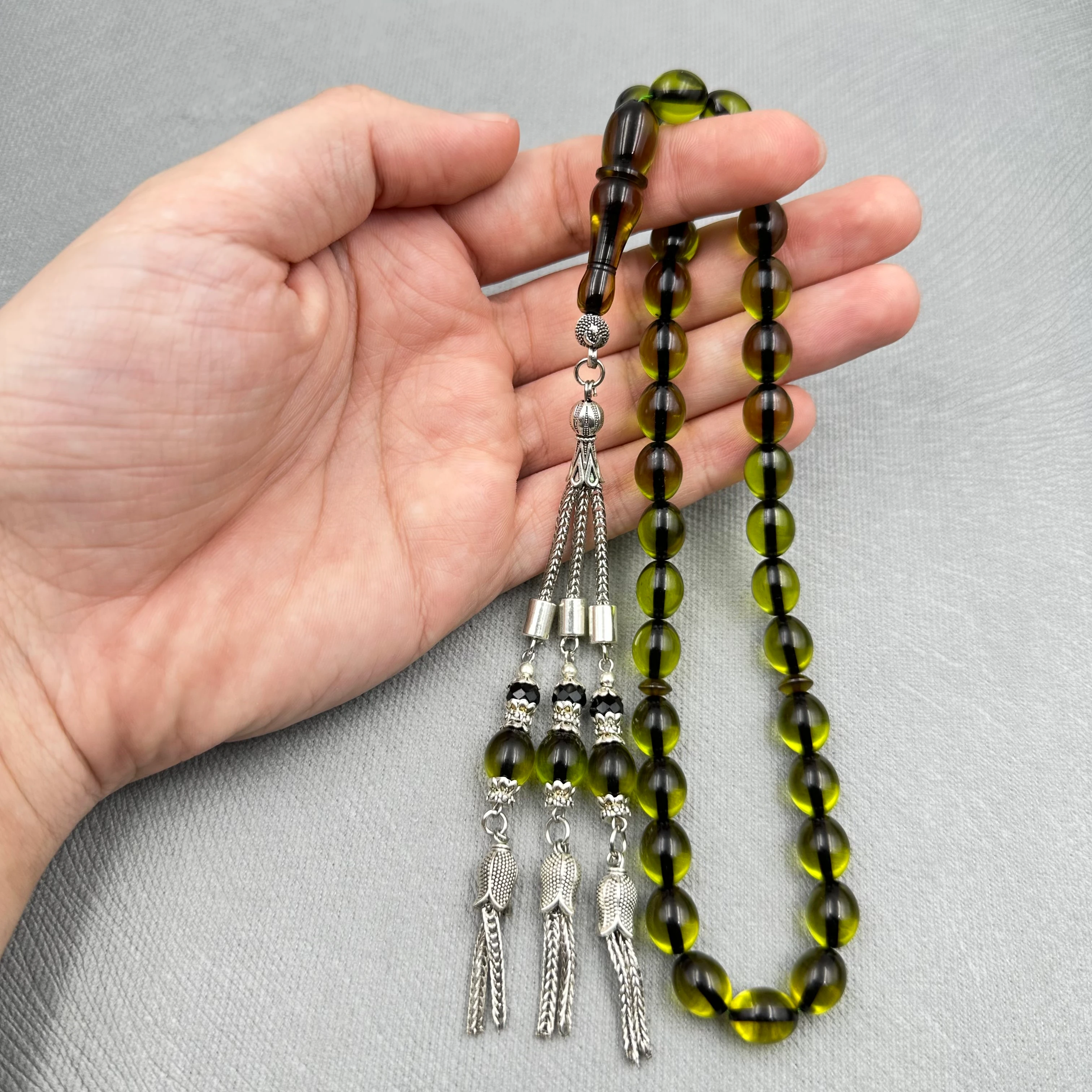 Zeytin Yeşili Yumurta Kesim Üçlü Alpaka Püsküllü Kehribar Tespih 