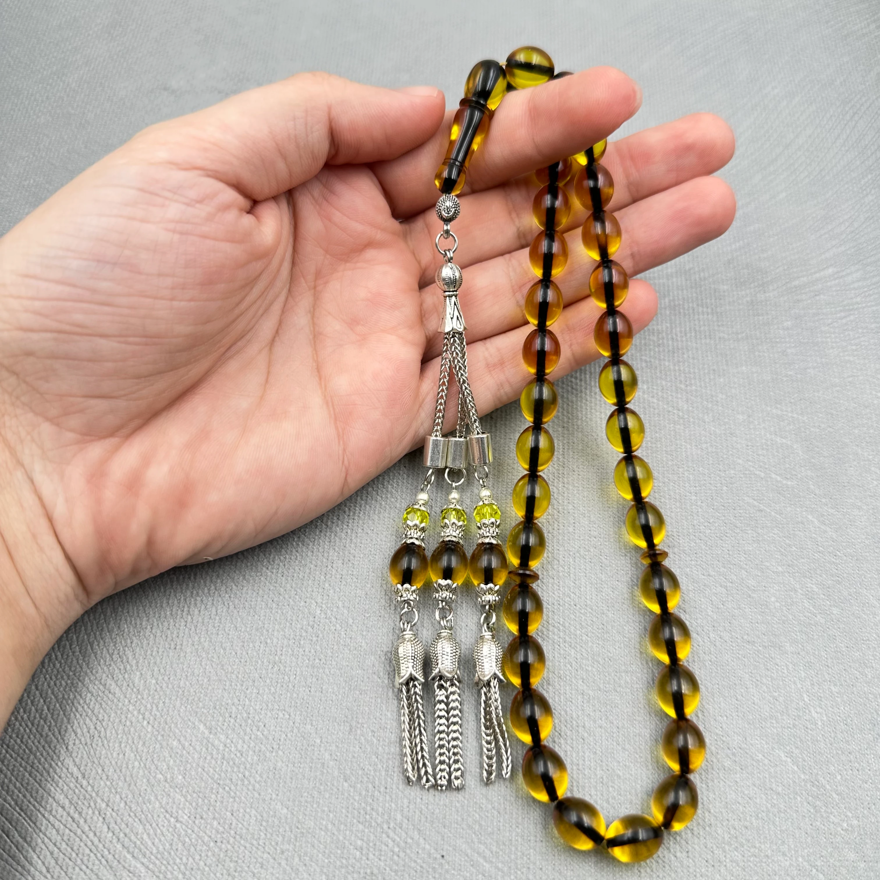 Kehribar Tonlu Şeffaf Yumurta Kesim Üçlü Alpaka Püsküllü Ateş Kehribar Tespih