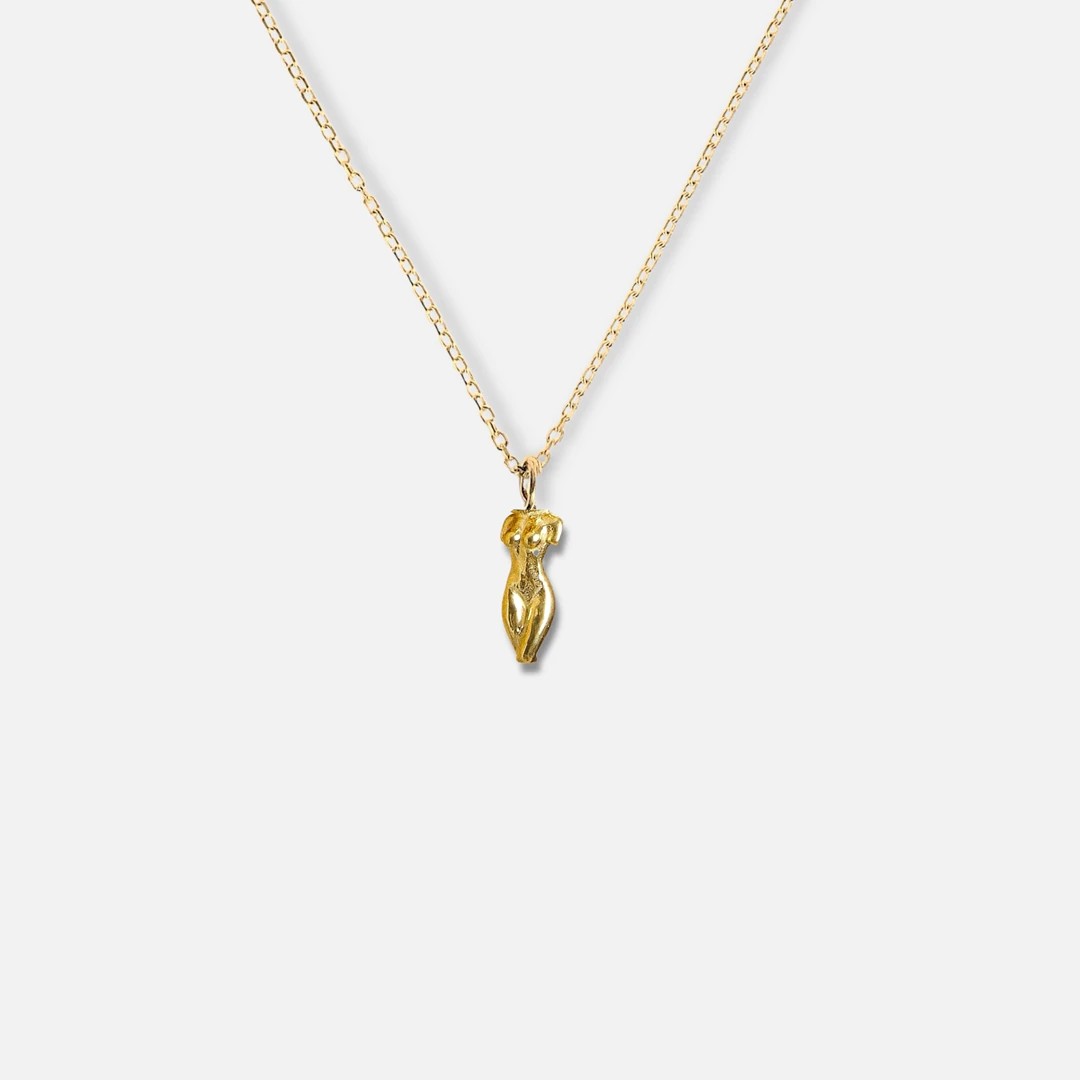 statue of a lady necklace