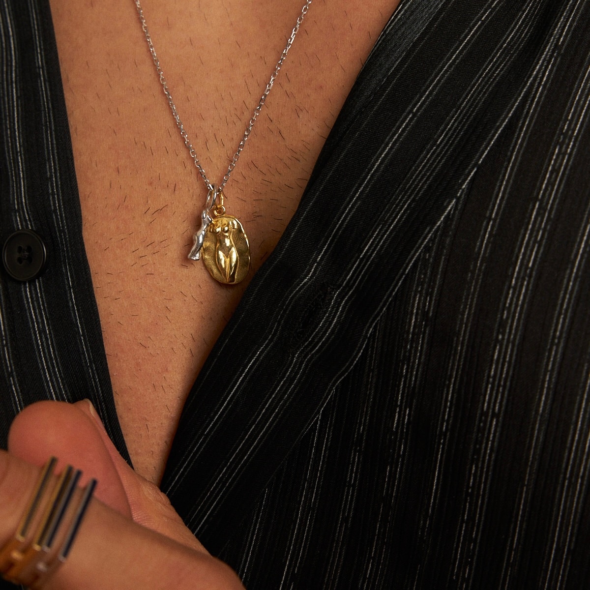 silhouette x statue of a lady necklace
