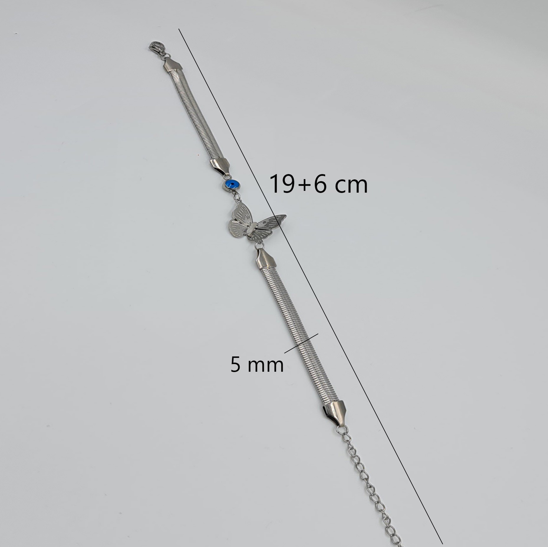 Kelebek Figürlü Gümüş Renk Çelik Bileklik – Nazar Detaylı, Ayarlanabilir Uzunluk (19+6 cm, 5 mm Zincir)