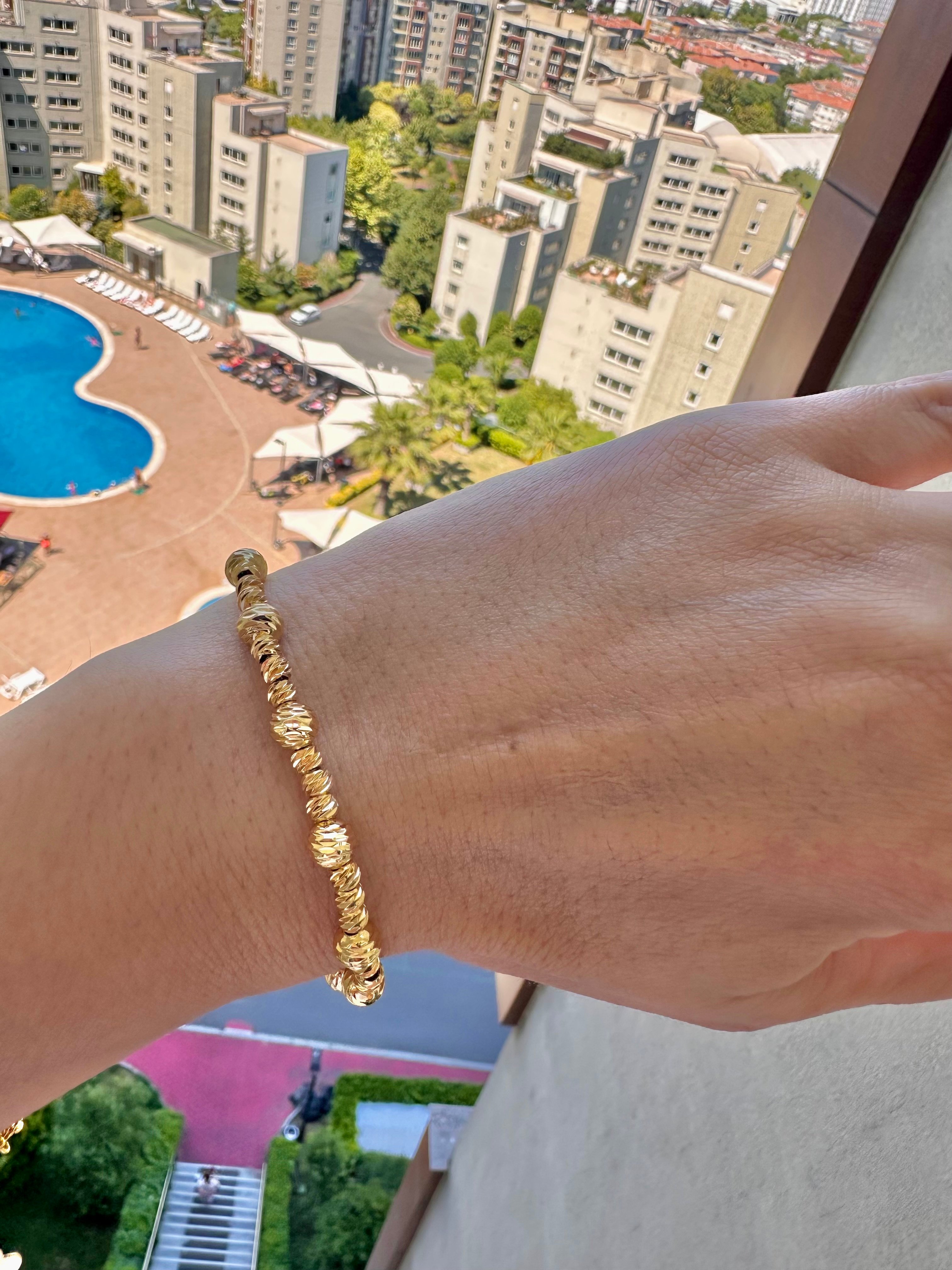Büyük küçük topçuklu dorika çelik bileklik gold