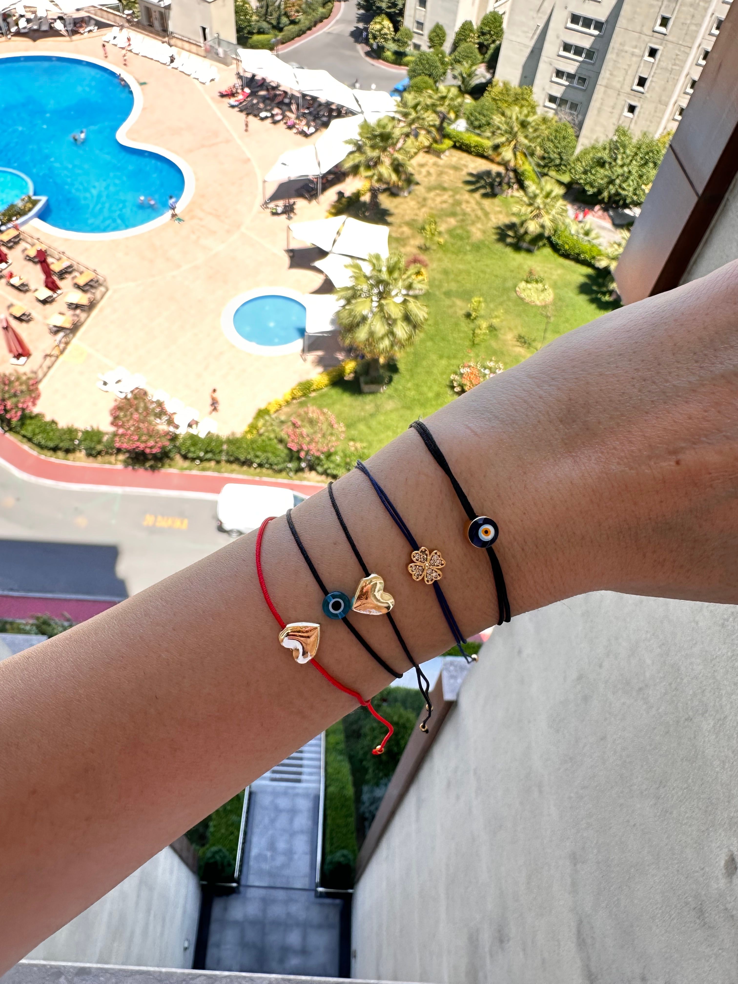 Gold renk taşlı yonca model lacivert ip bileklik