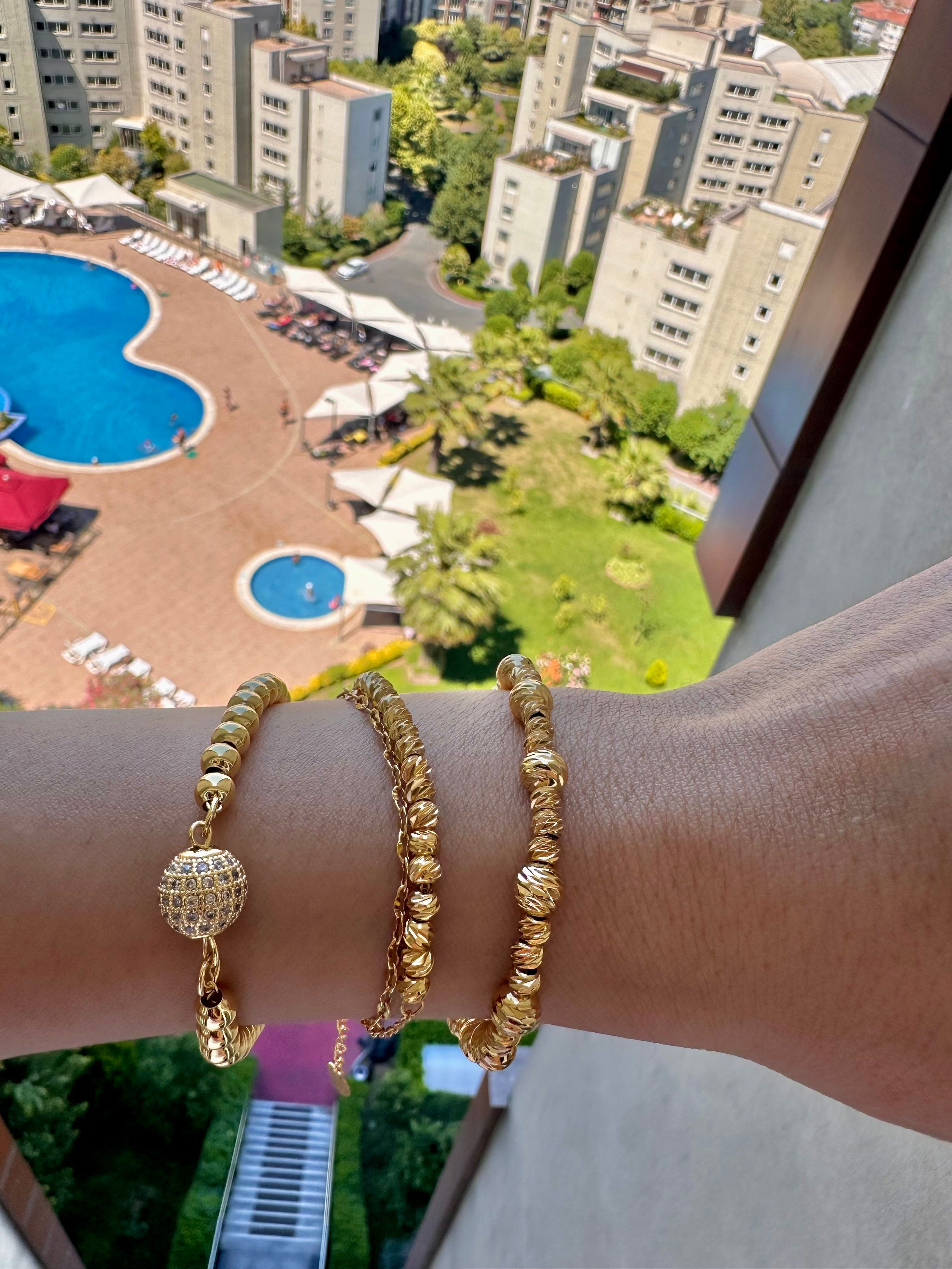 Büyük küçük topçuklu dorika çelik bileklik gold
