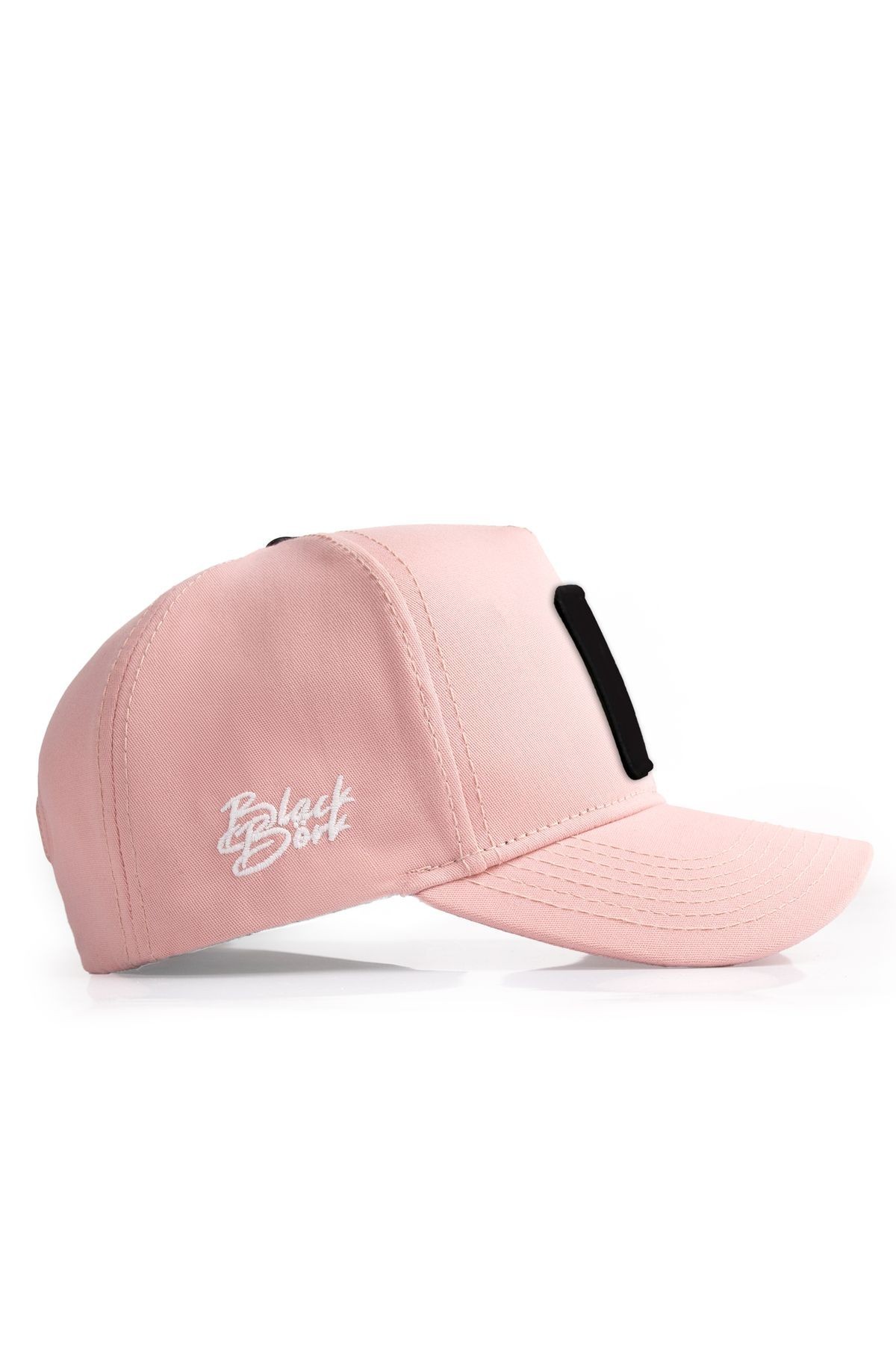 Salmon-colored baseball cap with Queen logo