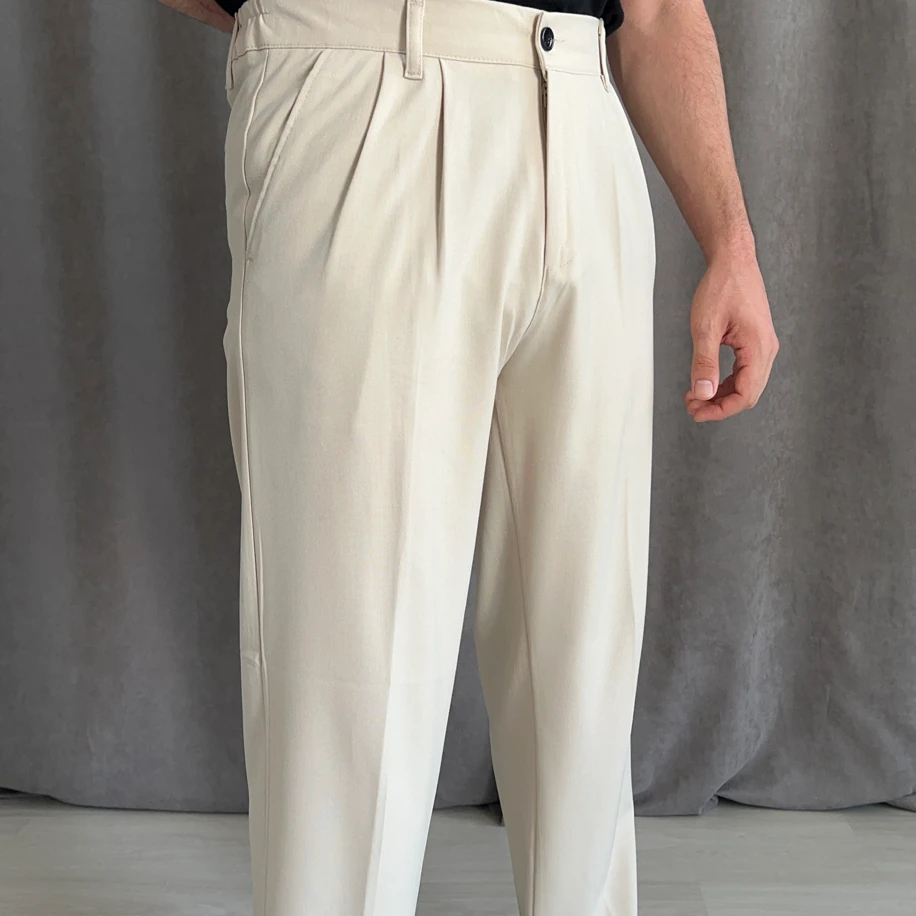 Pile Detaylı Beli Lastikli Baggy Kalıp Kumaş Pantolon - Bej