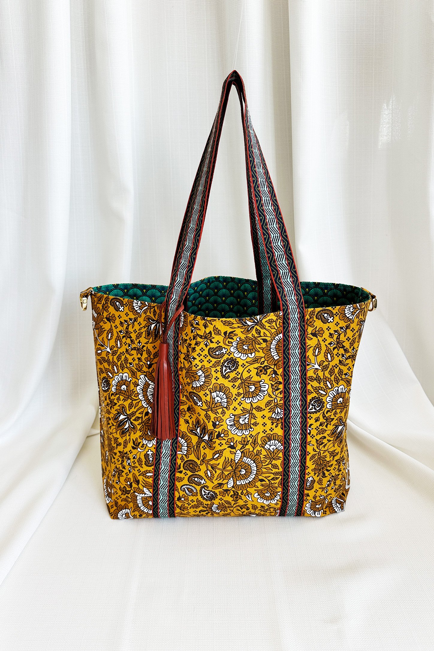 Retro and Floral Patterned Reversible Leather Tassel Bag