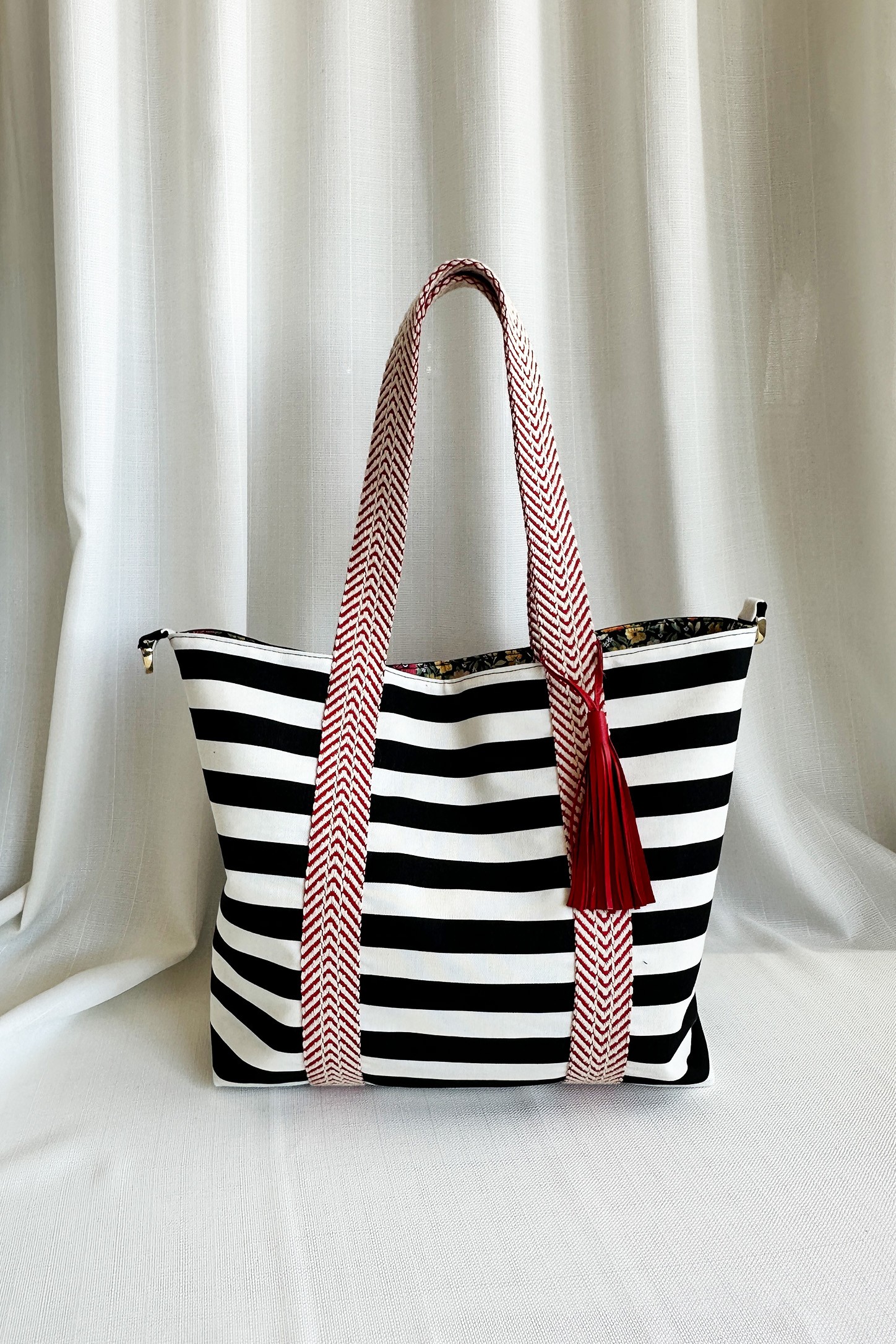 Striped and Floral Patterned Reversible Leather Tassel Bag