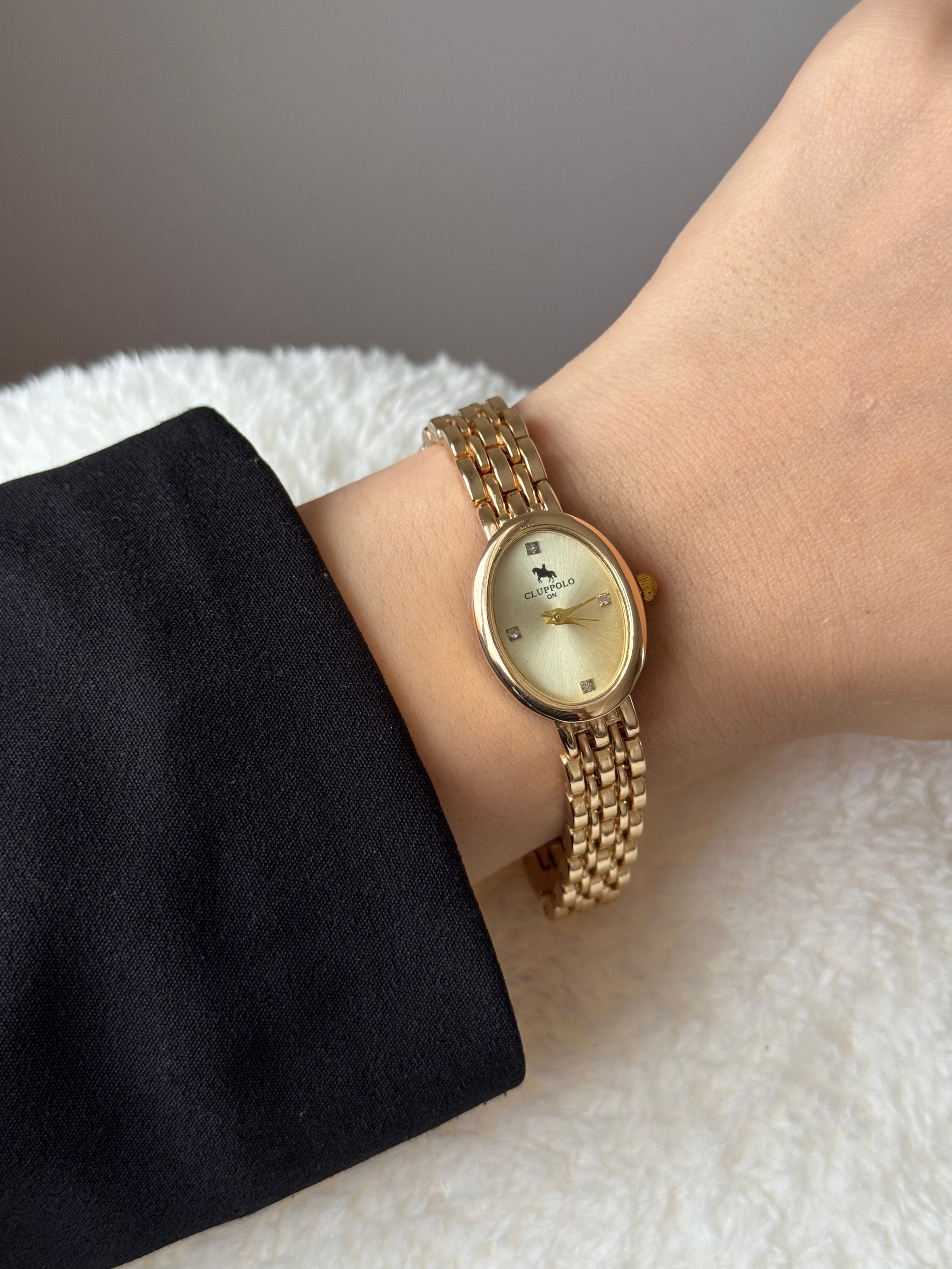 Altın Renk Oval Kasa Krem Kadran Zincir Bilezikli Çelik Kadın Kol Saati