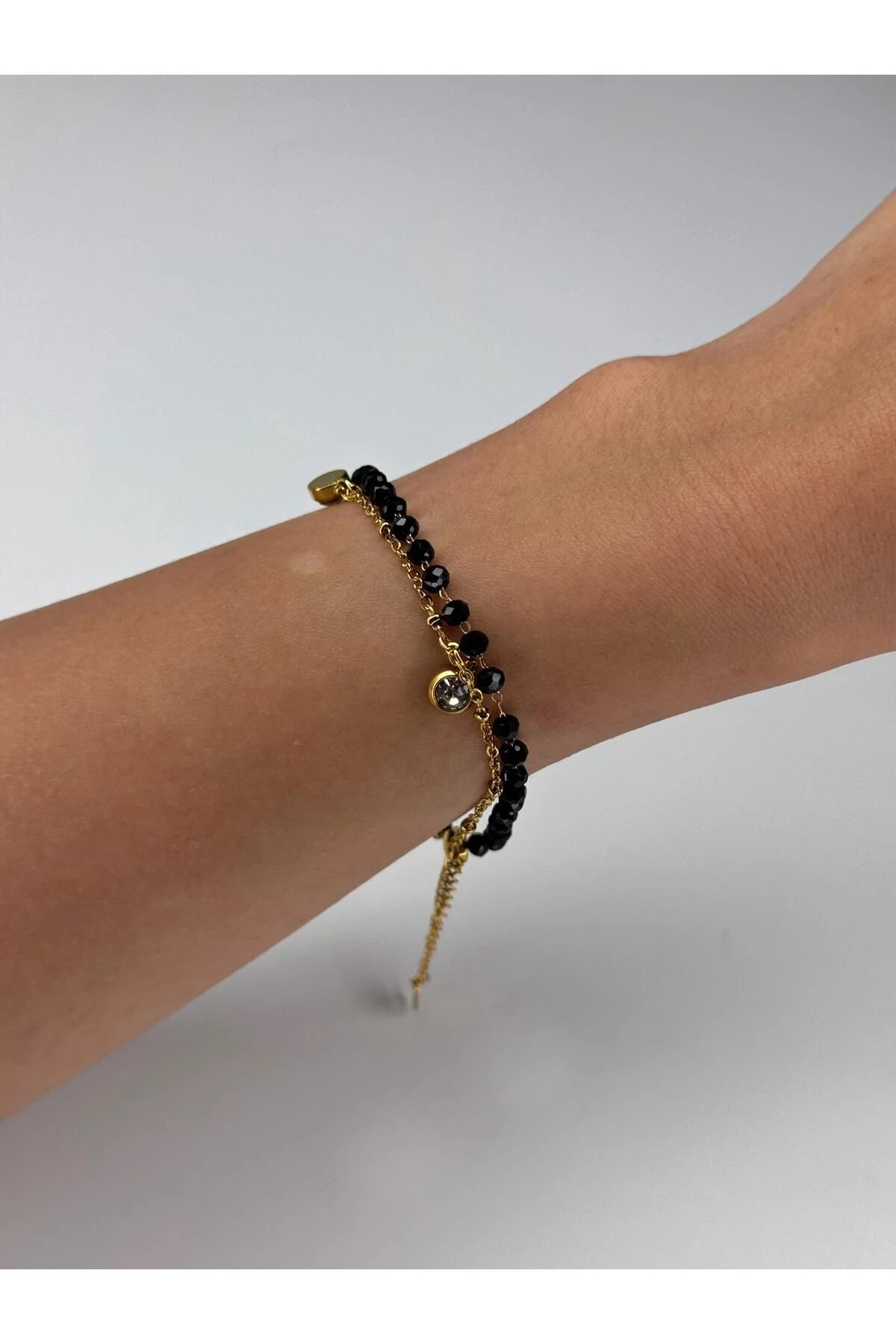 Gold Dangling Black Bead Bracelet