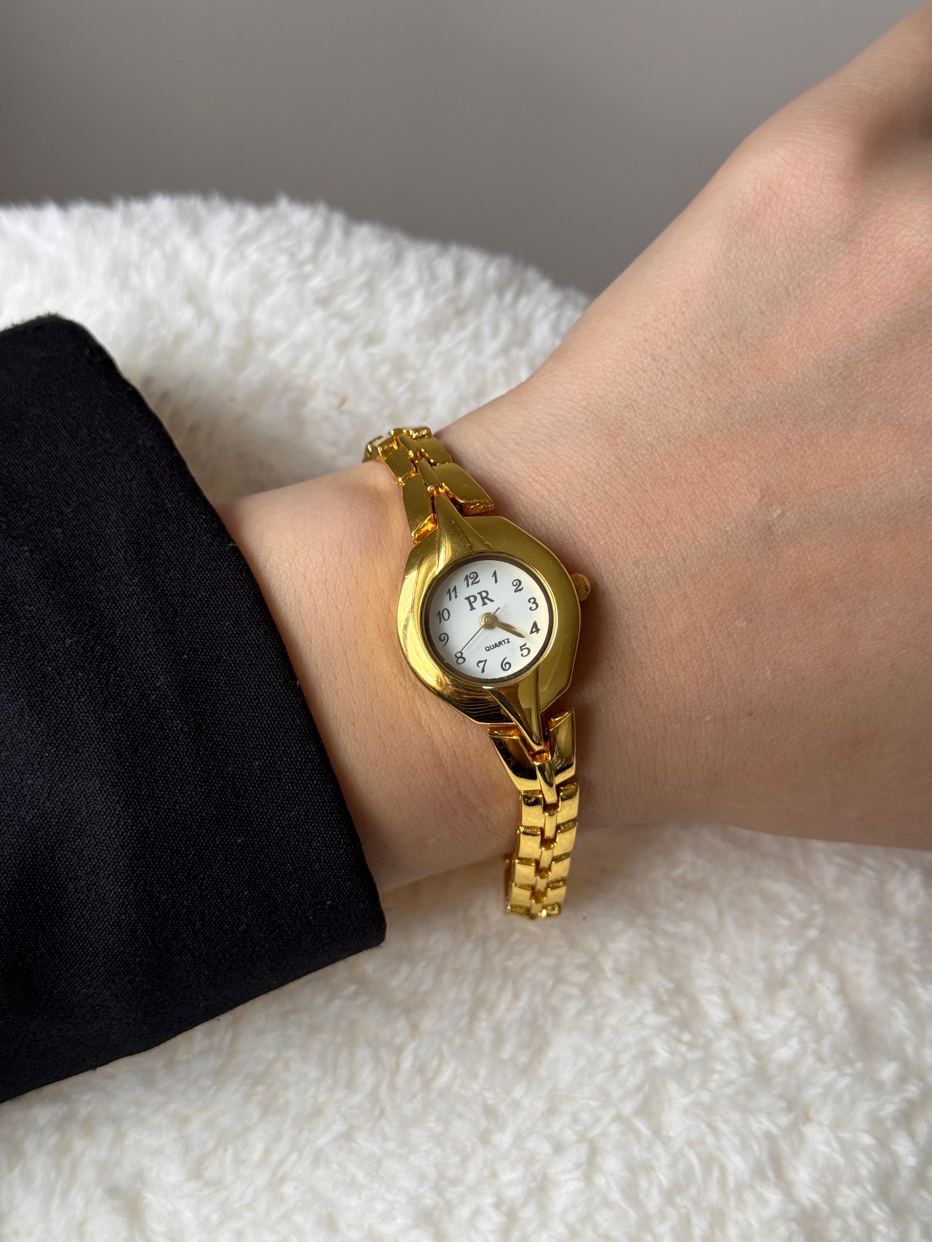 Altın Renk Yuvarlak Kasa Beyaz Kadran Zincir Bilezikli Çelik Kadın Kol Saati