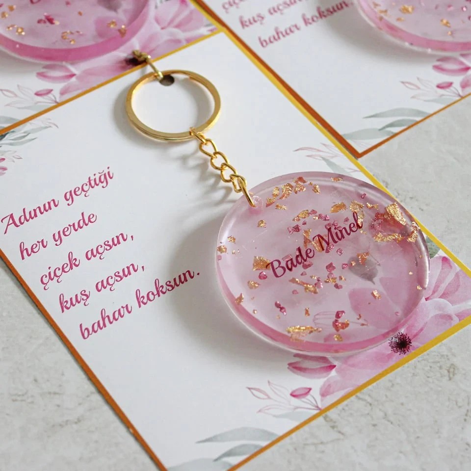 Pembe Renkli Altın Varak Süslemeli Hediyelik Bebek Anahtarlığı