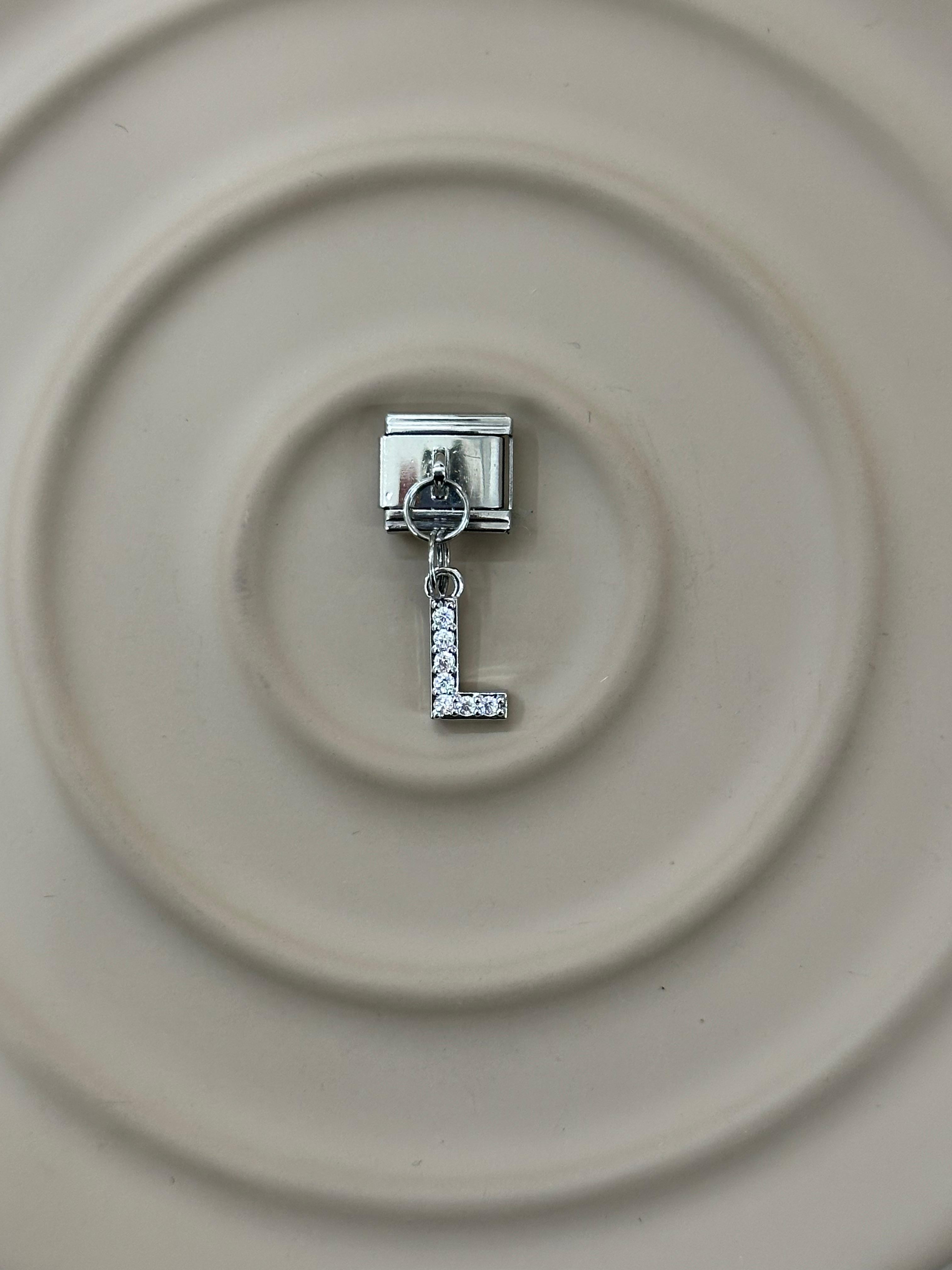 L Harfli Nomination Charm