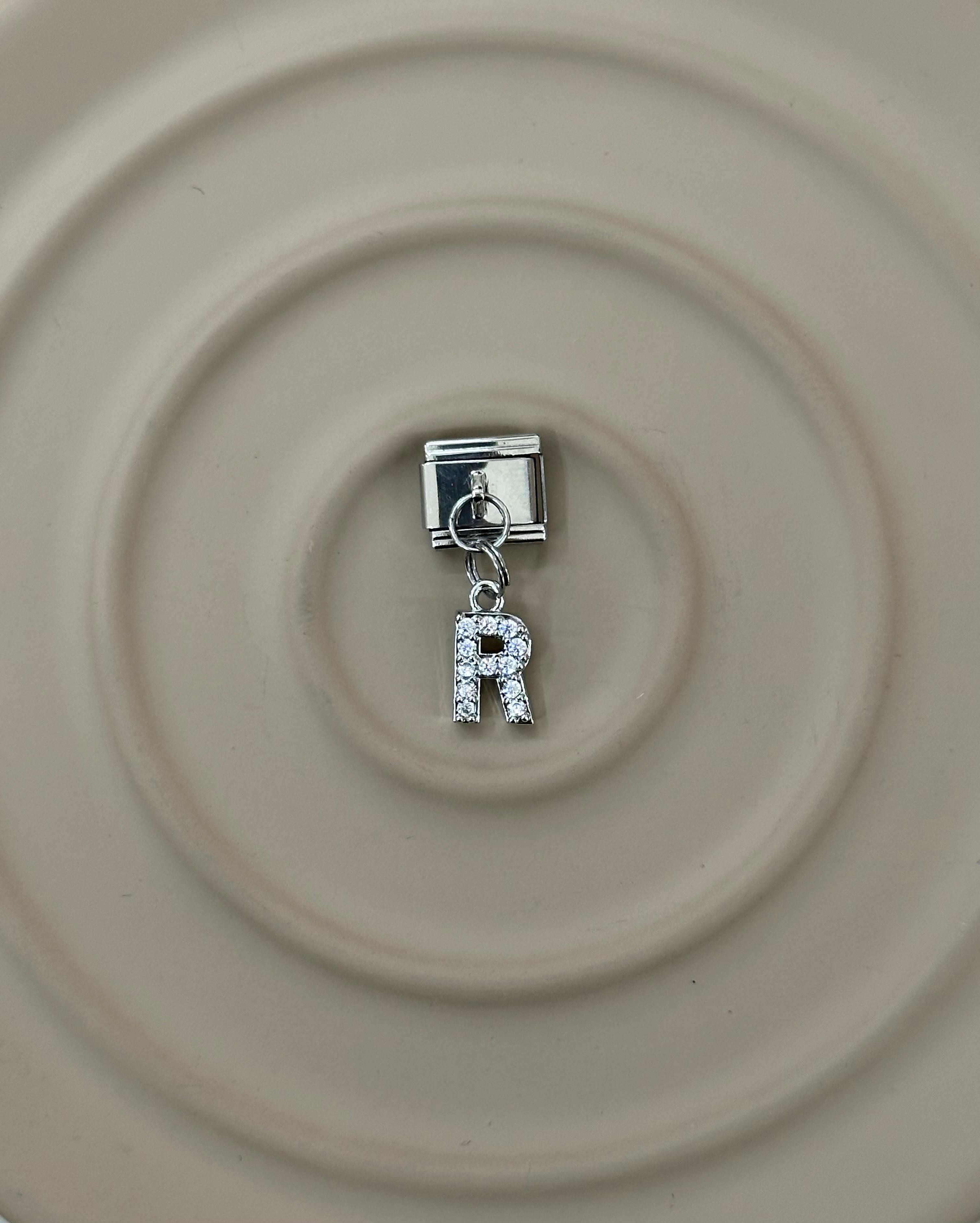 R Harfli Nomination Charm