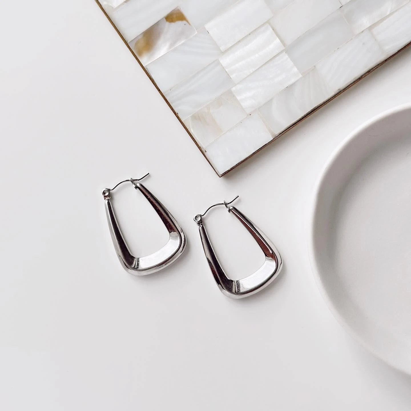 Spandrel gri çelik küpe