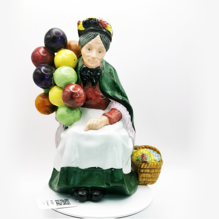 The Leonardo Collection Balloon Seller Sitting Elderly Woman Figurine - 20 cm Height, 14 cm Width