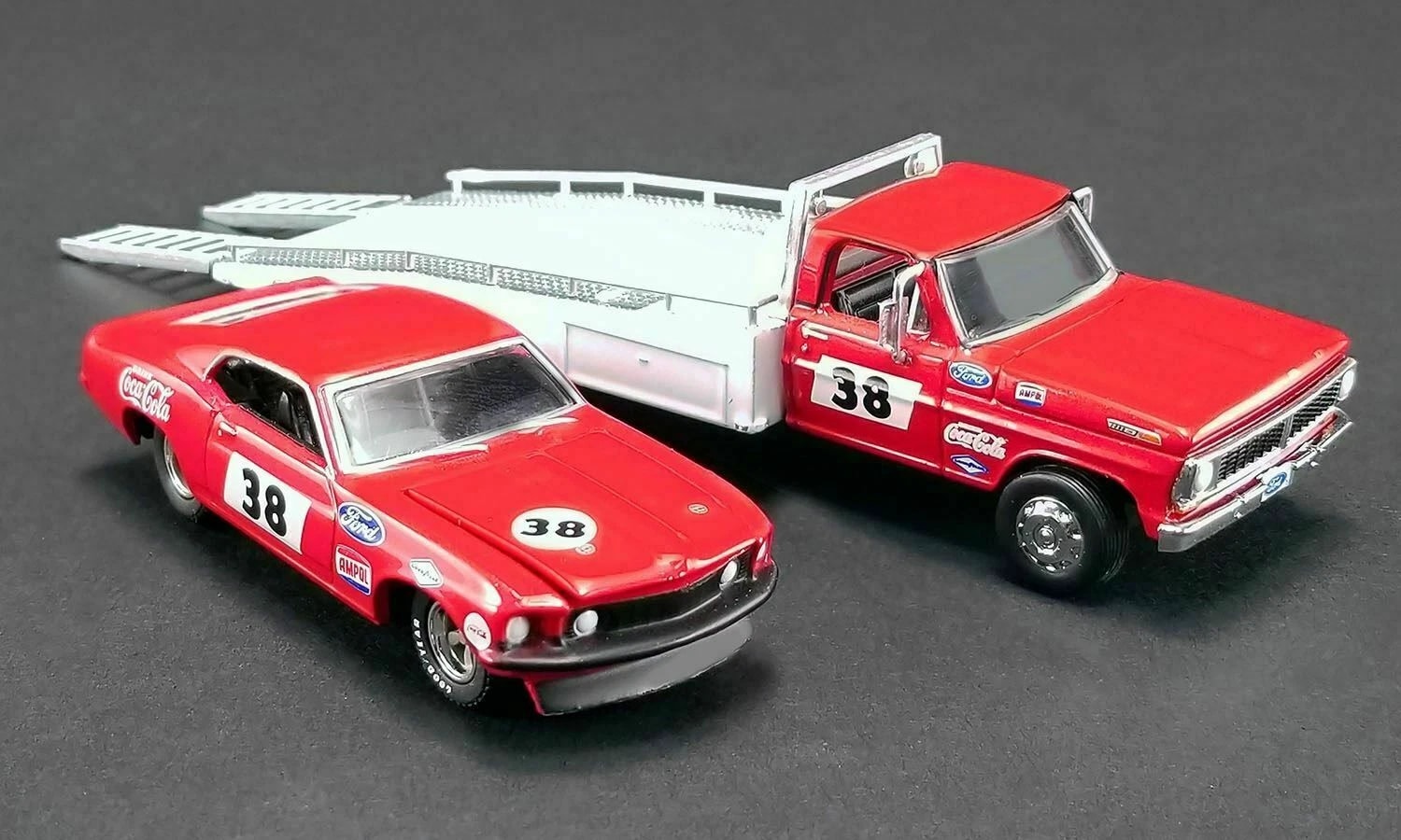 Acme | 51269 | 1/64 1969 allan moffat racing trans am mustang #38 on a ford f-350 ramp truck.