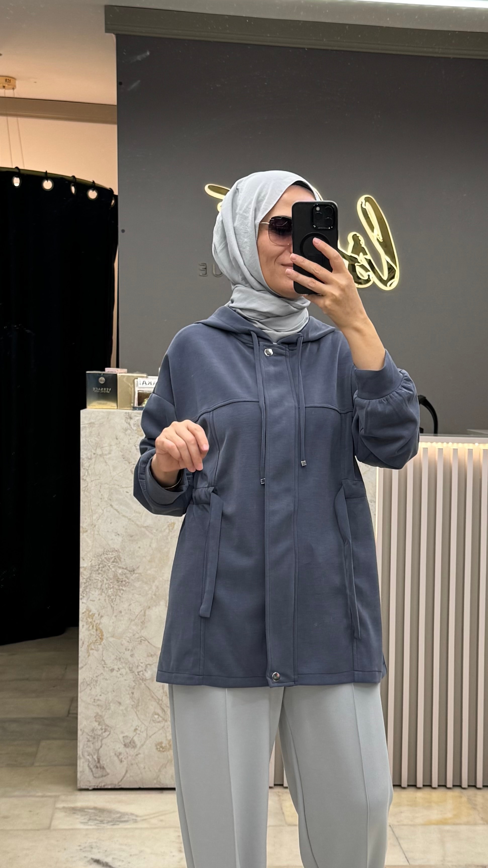 BELİ  TÜNELLİ KAPAKLI SWEAT