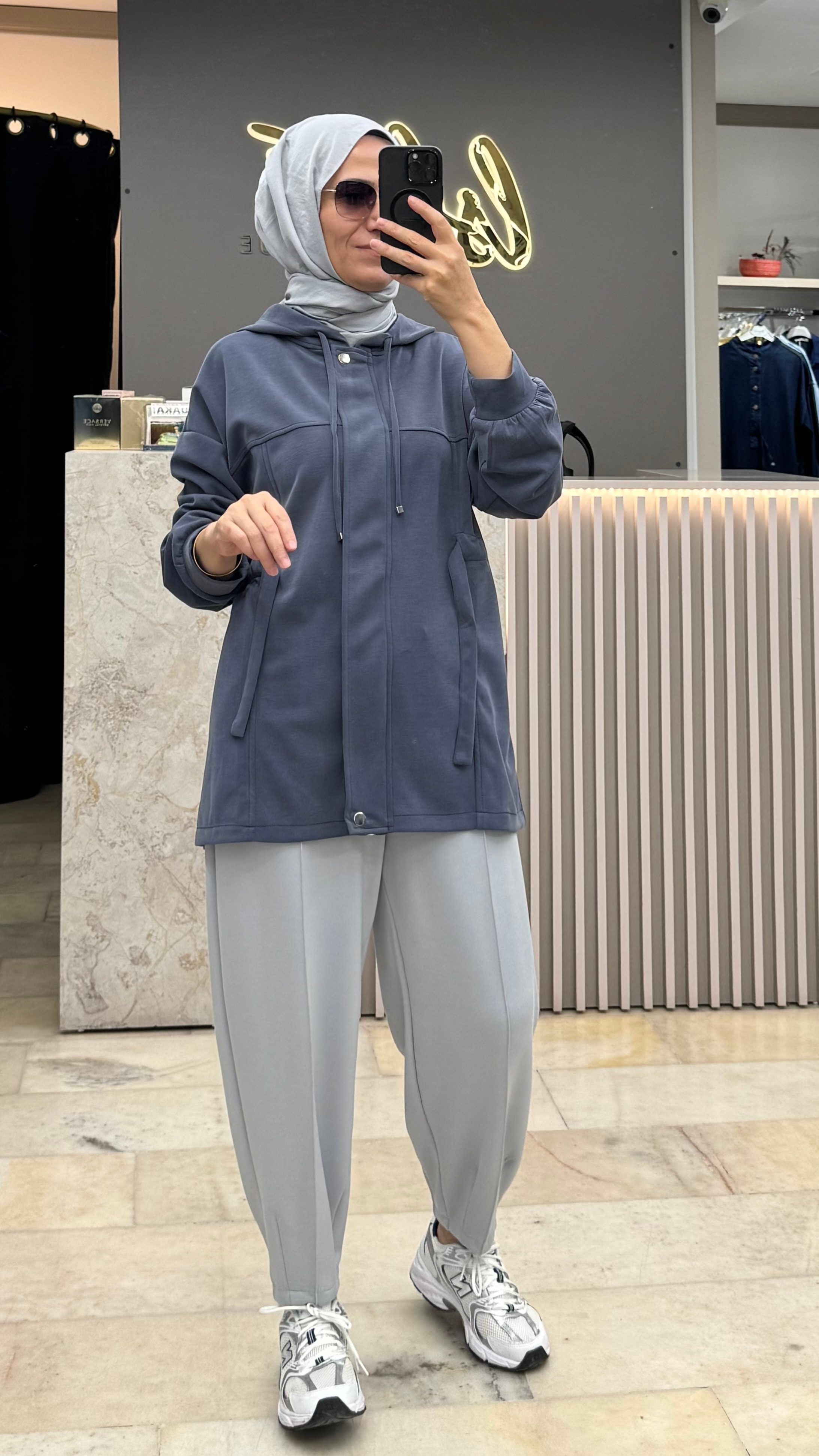 BELİ  TÜNELLİ KAPAKLI SWEAT