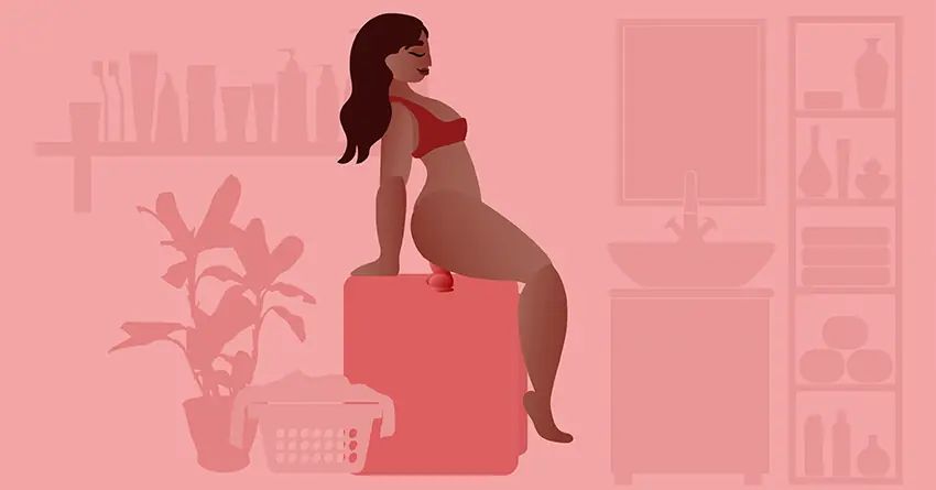 Aşk Makinesi (Love Machine) pozisyonu: Çamaşır makinesi veya kutu üzerine yapıştırılmış vantuzlu dildonun üzerine oturan kırmızı iç çamaşırlı kadın.