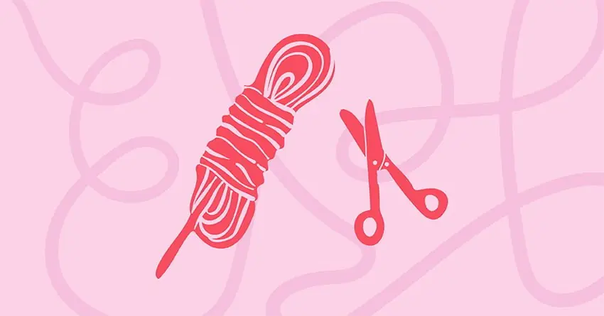 Shibari için gerekli olan kırmızı ip yumağı ve acil durum güvenlik makası.