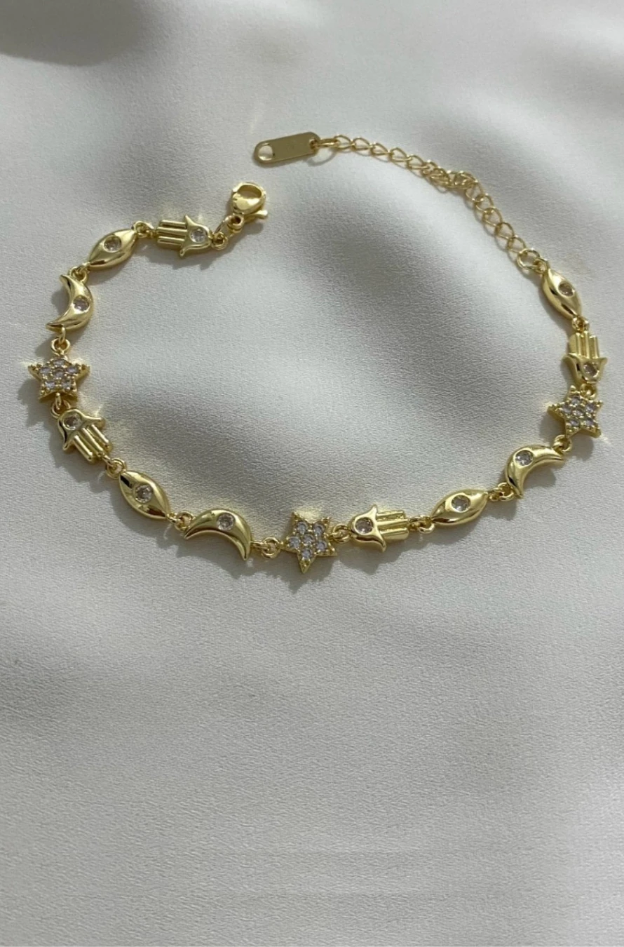 SIRALI NAZAR MODEL KARARMAZ ÇELİK ALTIN RENKLİ BİLEKLİK