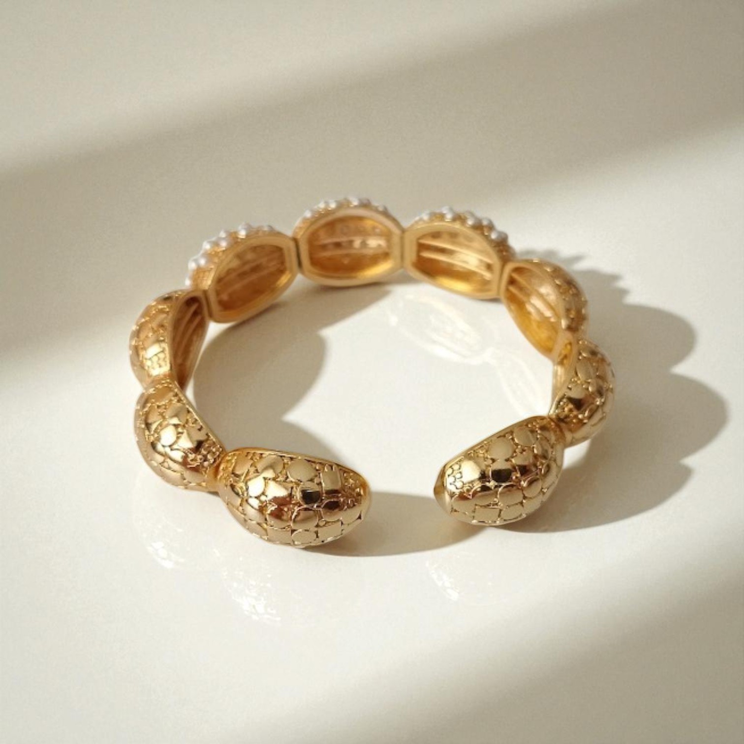 Dome Bracelet with Geometric Patterns and Pearl Details