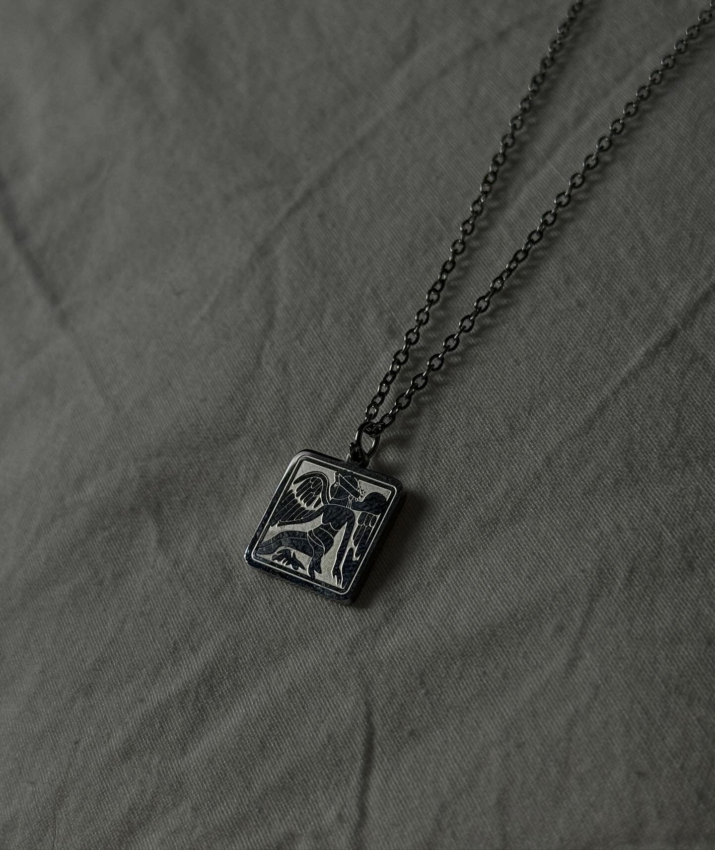 Silver E. Symbol Necklace
