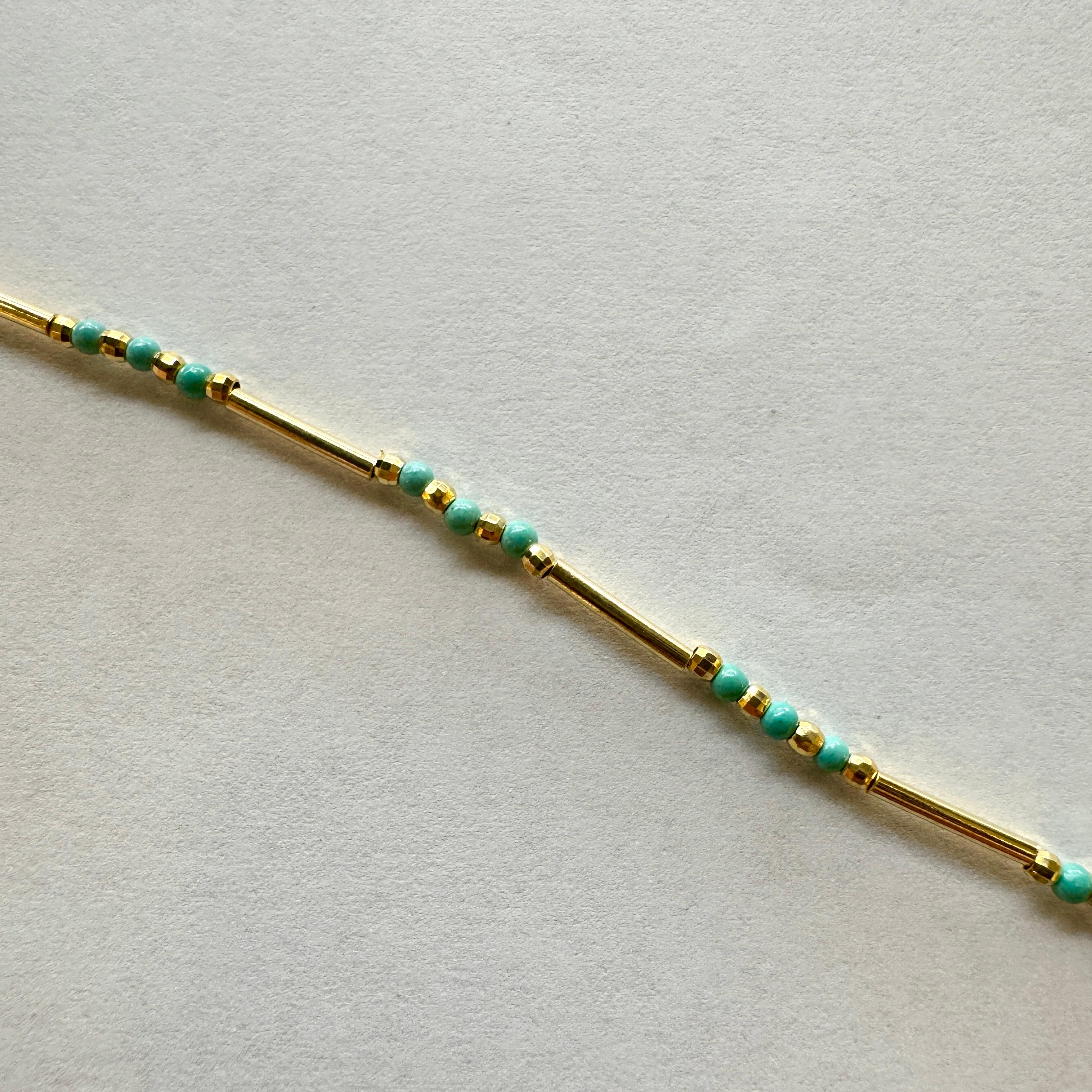 Turquoise tube bracelet gold