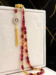 Ayyıldız Motifli Kırmızı Şeffaf Tonda 925 ayar Gümüş Püsküllü Ateş Kehribarı Tesbih