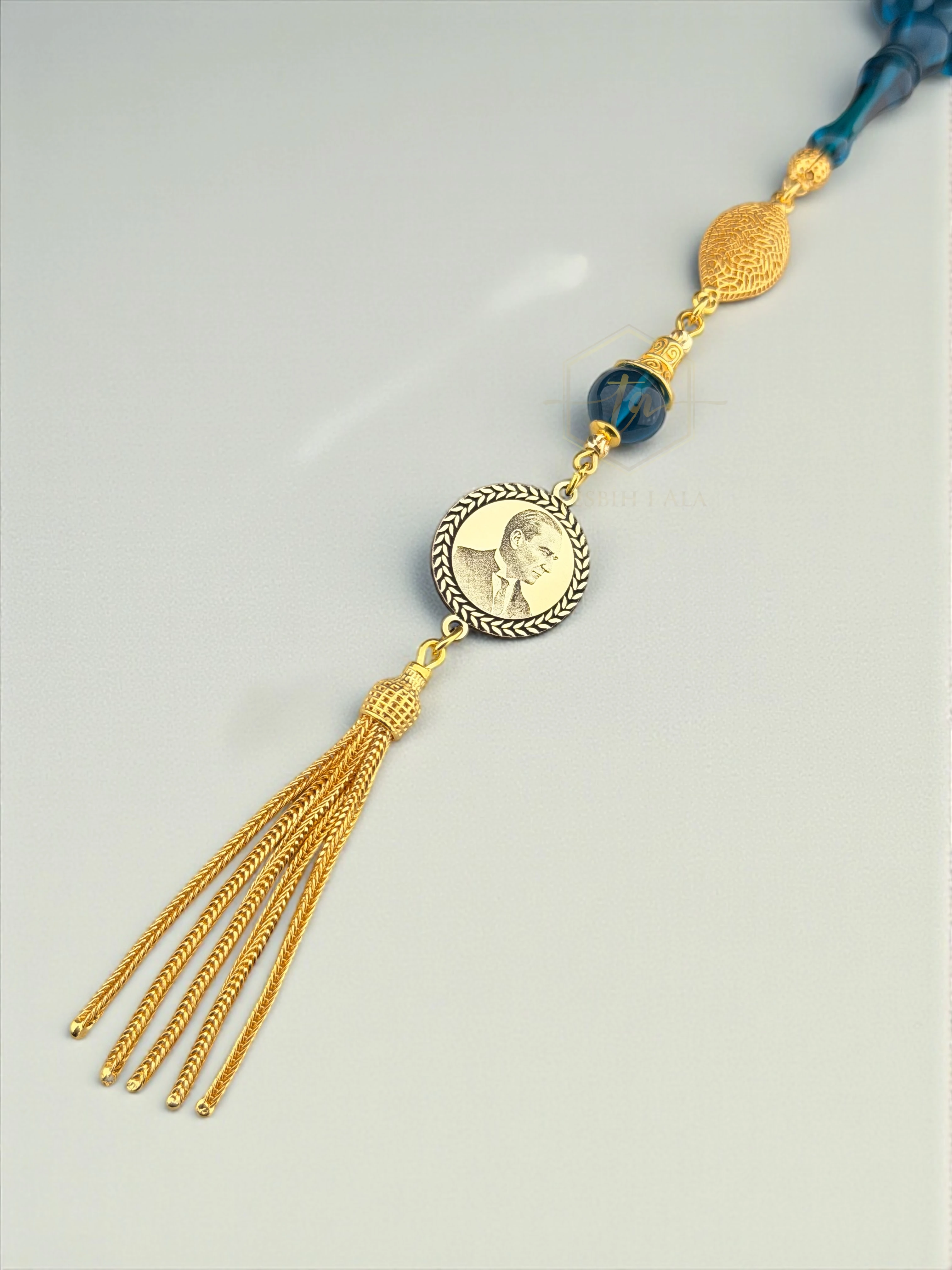 Sonsuzluk Mavisi Atatürk Portreli Ateş Kehribarı – 925 Ayar Gümüş Püsküllü Özel Tasarım Tesbih