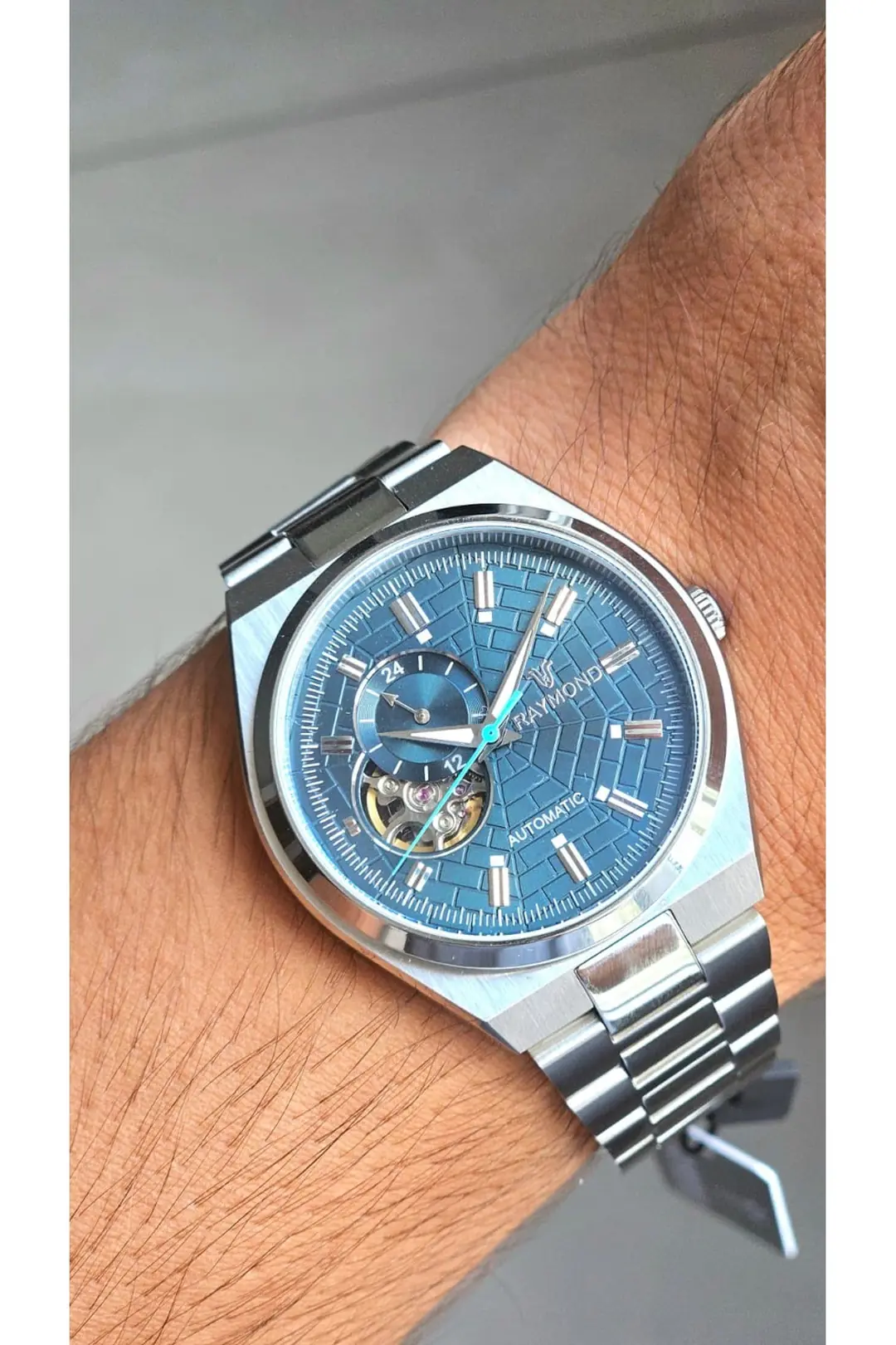 RYM-250424 RAYMOND ERKEK OTOMATİK SAAT - PASLANMAZ ÇELİK VE SAFİR