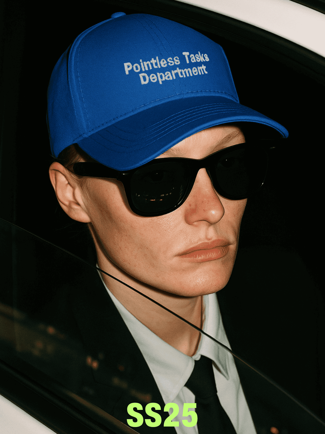 masculine woman wears blue baseball cap
