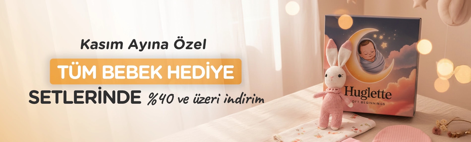 Huglette Tavşan Kasım ayına özel Tüm Bebek Setlerinde %40 ve üzeri indirim yazısına bakıyor