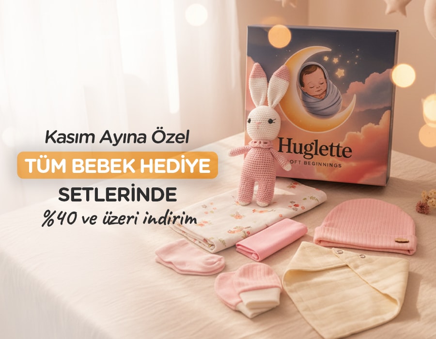 Huglette Tavşan Kasım ayına özel Tüm Bebek Setlerinde %40 ve üzeri indirim yazısına bakıyor